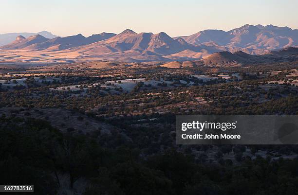 Mountains rise over Arizona border area on February 26, 2013 near Sonoita, Arizona. The Federal government has increased the Border Patrol presence...