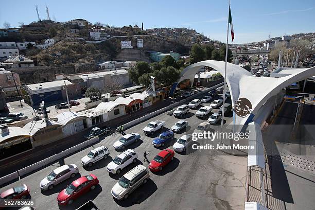 Traffic from Mexico waits to cross into the United States on February 26, 2013 in Nogales, Arizona. Some 15,000 people cross between Mexico and the...