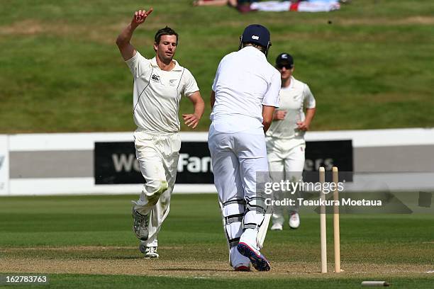 Carl Cachopa of the New Zealand XI celebrates the wicket of Joe Root of England during the International tour match between New Zealand XI and...