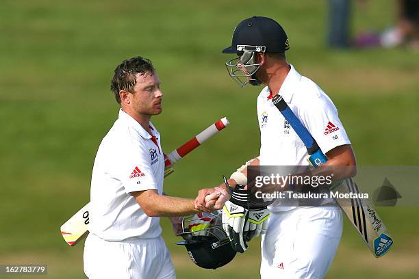 Ian Bell of England is congratulated by Stuart Broad of England after the International tour match between New Zealand XI and England at Queenstown...