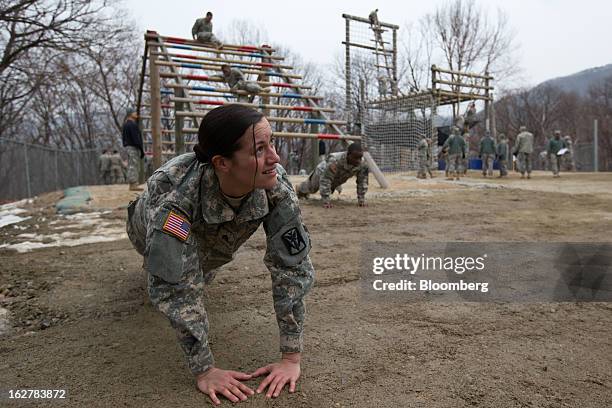 Sergeant Asyah Moore, a soldier with the U.S. Army's Second Infantry Division, does push-ups during an air assault training course at Camp Casey in...