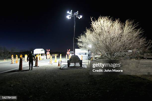 Border Patrol agent walks through a Border Patrol tactical checkpoint on February 26, 2013 near Sonoita, Arizona. The Federal government has...