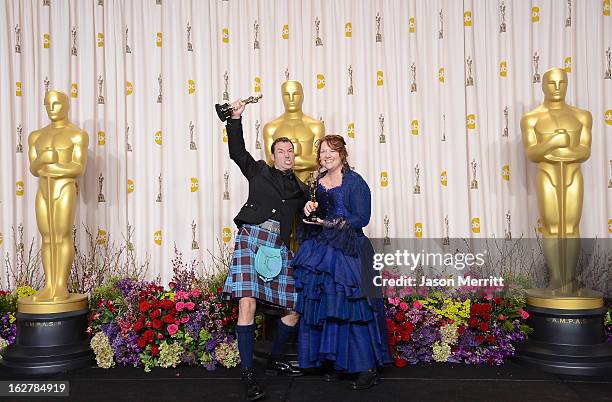 Directors Mark Andrews and Brenda Chapman, winners of the Best Animated Feature award for 'Brave,' pose in the press room during the Oscars held at...