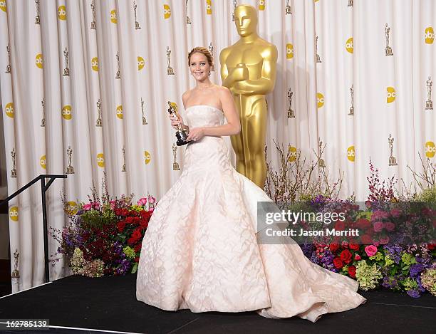 Actress Jennifer Lawrence, winner of the Best Actress award for 'Silver Linings Playbook,' poses in the press room during the Oscars held at Loews...