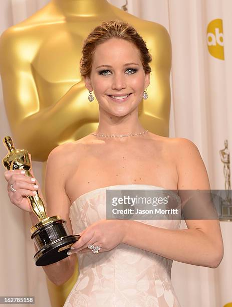Actress Jennifer Lawrence, winner of the Best Actress award for 'Silver Linings Playbook,' poses in the press room during the Oscars held at Loews...