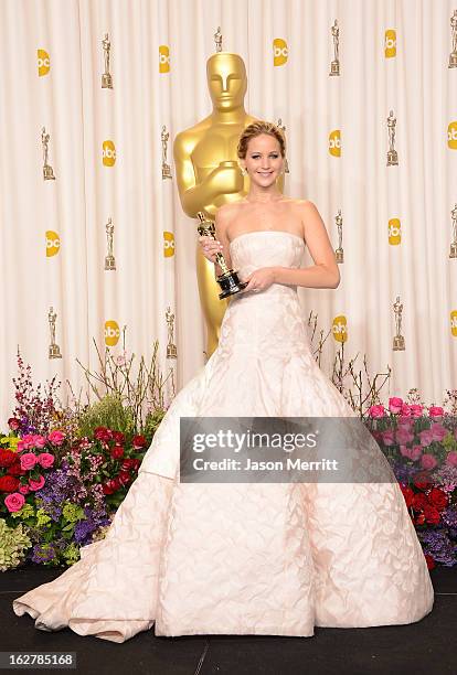 Actress Jennifer Lawrence, winner of the Best Actress award for 'Silver Linings Playbook,' poses in the press room during the Oscars held at Loews...