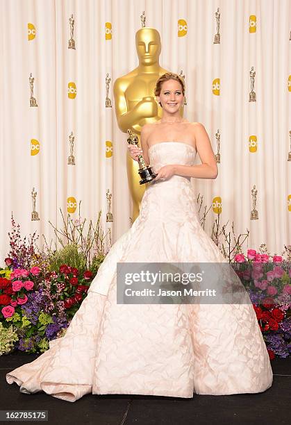 Actress Jennifer Lawrence, winner of the Best Actress award for 'Silver Linings Playbook,' poses in the press room during the Oscars held at Loews...