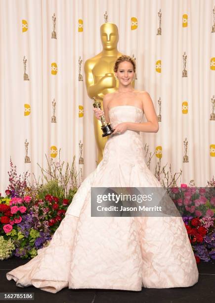 Actress Jennifer Lawrence, winner of the Best Actress award for 'Silver Linings Playbook,' poses in the press room during the Oscars held at Loews...