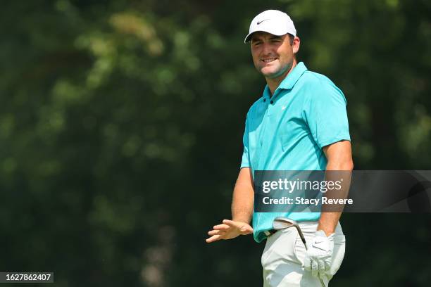 Scottie Scheffler of the United States reacts to his shot on the fourth hole during the final round of the BMW Championship at Olympia Fields Country...