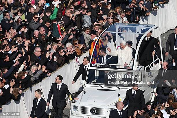 Pope Benedict XVI travels in the popemobile as he arrives in St Peter's Square ahead of final general audience before his retirement on February 27,...