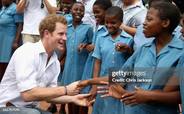 Prince Harry meets meets 15 year old orphan Keneuoe and partially sighted children at St Bernadette's Centre for the blind, a project supported by...