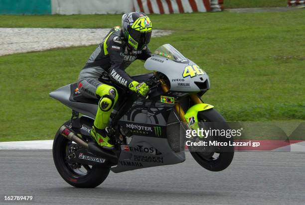 Valentino Rossi of Italy and Yamaha Factory Racing lifts the front wheel during the MotoGP Tests in Sepang - Day Two at Sepang Circuit on February...