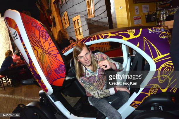 Christophe GuillarmeÊposes in a Twizzy car he designed during the Christophe Guillarme Fall/Winter 2013 Ready-to-Wear show as part of Paris Fashion...