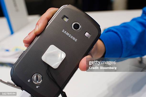 The reverse side of a Samsung Electronics Co. Galaxy Xcover 2 smartphone is displayed for a photograph at the Mobile World Congress in Barcelona,...