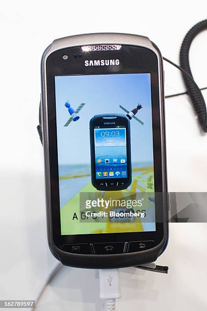 And GLONASS logos are seen on the screen of a Samsung Electronics Co. Galaxy Xcover 2 smartphone at the Mobile World Congress in Barcelona, Spain, on...