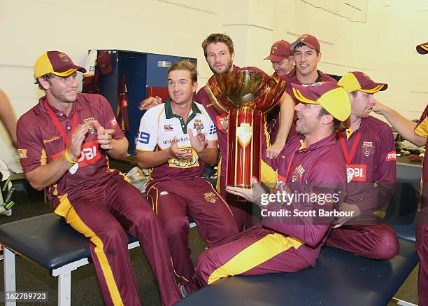 The Bulls celebrate in the changing rooms after winning the Ryobi One Day Cup final match between the Victorian Bushrangers and the Queensland Bulls...