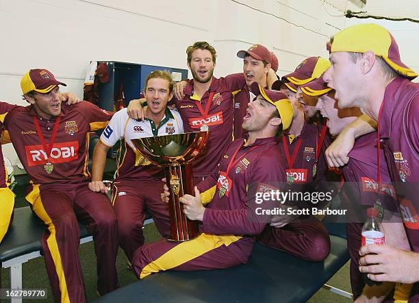 The Bulls celebrate in the changing rooms after winning the Ryobi One Day Cup final match between the Victorian Bushrangers and the Queensland Bulls...