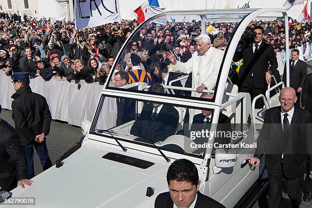 Pope Benedict XVI travels through the crowd in the popemobile in St Peter's Square on February 27, 2013 in Vatican City, Vatican. The Pontiff will...