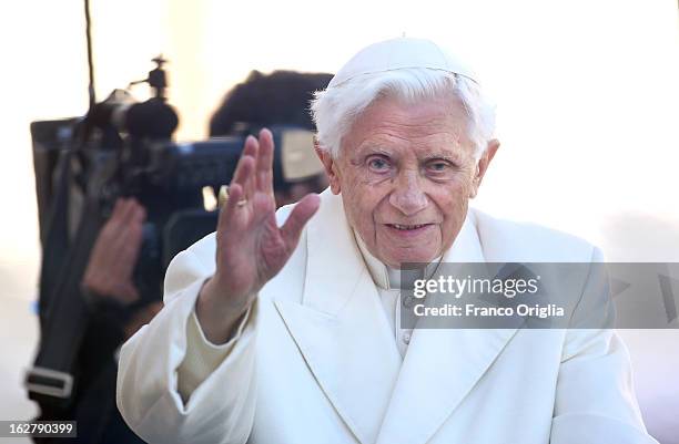 Pope Benedict XVI waves to the faithful as he arrives in St Peter's Square for his final general audience on February 27, 2013 in Vatican City,...