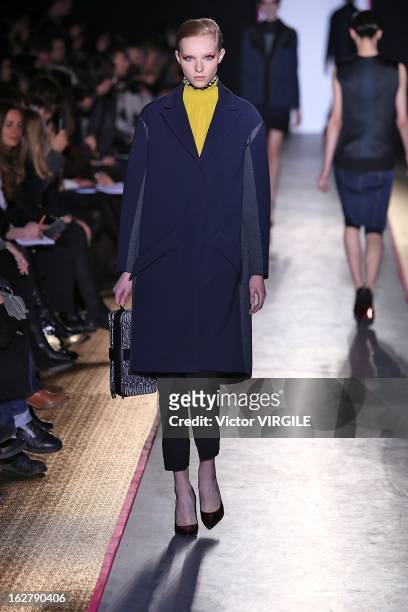 Model walks the runway during the Cedric Charlier Fall/Winter 2013/14 Ready-to-Wear show as part of Paris Fashion Week on February 26, 2013 in Paris,...