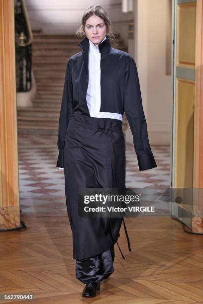 Model walks the runway during the Moon Young Hee Fall/Winter 2013/14 Ready-to-Wear show as part of Paris Fashion Week at Hotel de Varengeville on...