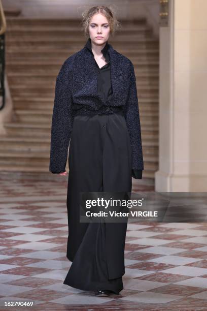 Model walks the runway during the Moon Young Hee Fall/Winter 2013/14 Ready-to-Wear show as part of Paris Fashion Week at Hotel de Varengeville on...