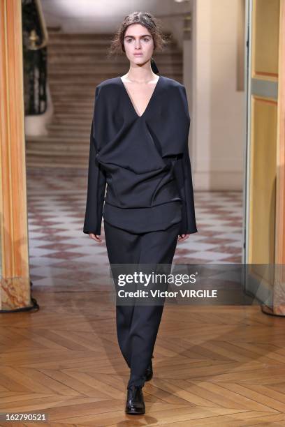 Model walks the runway during the Moon Young Hee Fall/Winter 2013/14 Ready-to-Wear show as part of Paris Fashion Week at Hotel de Varengeville on...