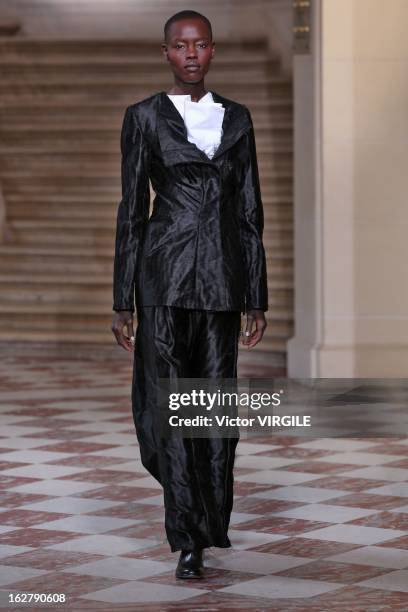 Model walks the runway during the Moon Young Hee Fall/Winter 2013/14 Ready-to-Wear show as part of Paris Fashion Week at Hotel de Varengeville on...