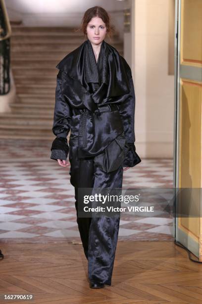 Model walks the runway during the Moon Young Hee Fall/Winter 2013/14 Ready-to-Wear show as part of Paris Fashion Week at Hotel de Varengeville on...