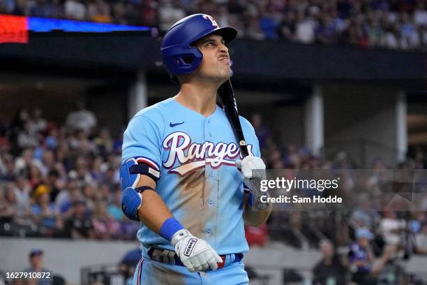 Nathaniel Lowe of the Texas Rangers walks back to his dugout after striking out during the fifth inning against the Milwaukee Brewers at Globe Life...