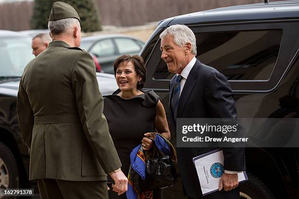 New Secretary of Defense Chuck Hagel and his wife Lilibet Hagel are greeted by USMC Lt. General Thomas Waldhauser, who will serve as Hagel's Senior...