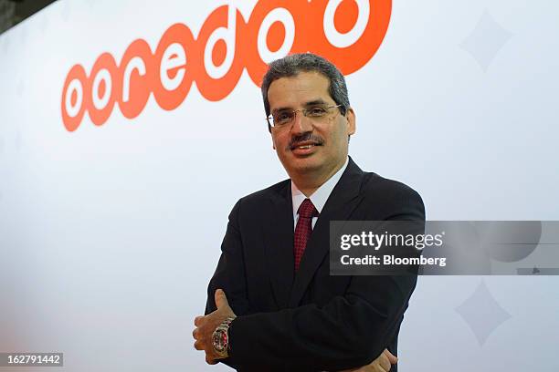 Nasser Marafih, chief executive officer of Qtel Group, poses for a photograph in the Ooredoo pavilion at the Mobile World Congress in Barcelona,...