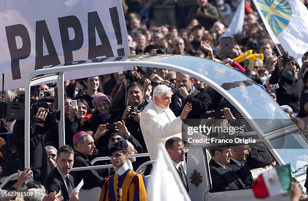Pope Benedict XVI waves to the faithful as he arrives in St. Peter's Square for his final general audience on February 27, 2013 in Vatican City,...