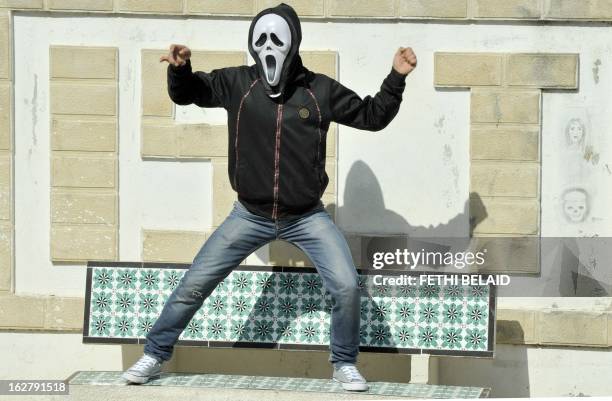 Tunisian student of the Bourguiba Language Institute in the El Khadra neighbourhood, a Salafist bastion of the capital Tunisia, performs the Internet...