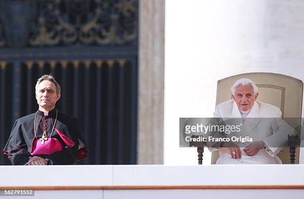 Pope Benedict XVI flanked by his personal secretary Georg Ganswein, attends his final general audience in St. Peter's Square on February 27, 2013 in...