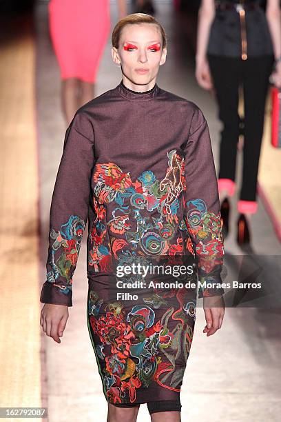 Model walks the runway during the Cedric Charlier Fall/Winter 2013 Ready-to-Wear show as part of Paris Fashion Week on February 26, 2013 in Paris,...