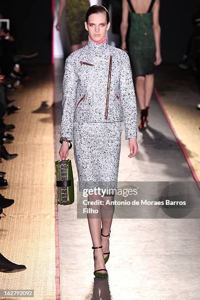 Model walks the runway during the Cedric Charlier Fall/Winter 2013 Ready-to-Wear show as part of Paris Fashion Week on February 26, 2013 in Paris,...