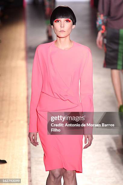 Model walks the runway during the Cedric Charlier Fall/Winter 2013 Ready-to-Wear show as part of Paris Fashion Week on February 26, 2013 in Paris,...