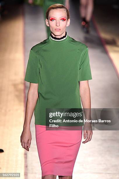 Model walks the runway during the Cedric Charlier Fall/Winter 2013 Ready-to-Wear show as part of Paris Fashion Week on February 26, 2013 in Paris,...