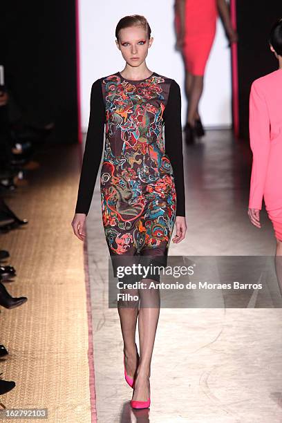 Model walks the runway during the Cedric Charlier Fall/Winter 2013 Ready-to-Wear show as part of Paris Fashion Week on February 26, 2013 in Paris,...