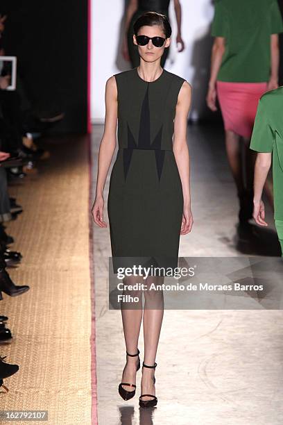 Model walks the runway during the Cedric Charlier Fall/Winter 2013 Ready-to-Wear show as part of Paris Fashion Week on February 26, 2013 in Paris,...