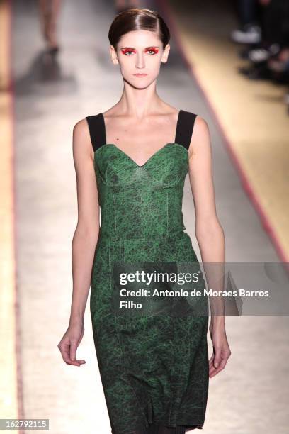 Model walks the runway during the Cedric Charlier Fall/Winter 2013 Ready-to-Wear show as part of Paris Fashion Week on February 26, 2013 in Paris,...