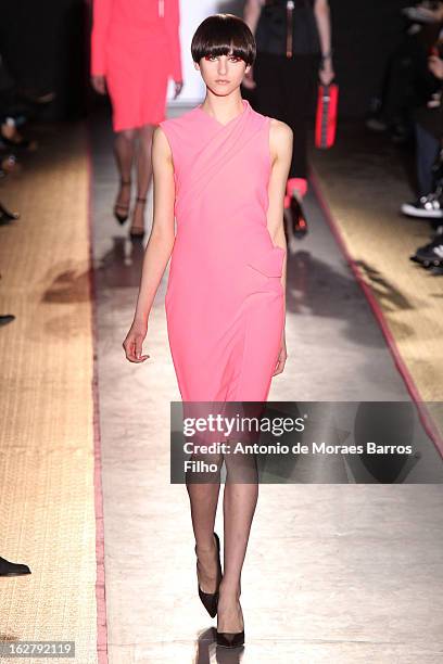 Model walks the runway during the Cedric Charlier Fall/Winter 2013 Ready-to-Wear show as part of Paris Fashion Week on February 26, 2013 in Paris,...