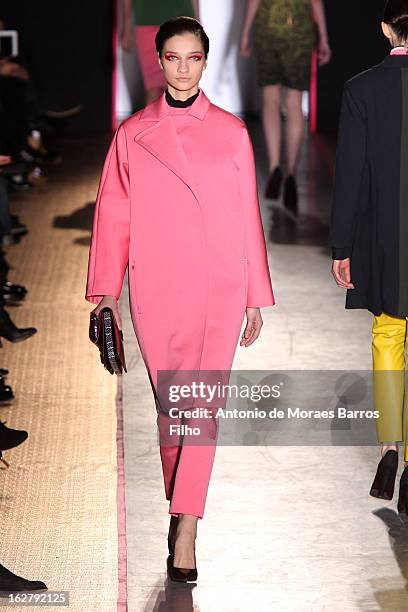 Model walks the runway during the Cedric Charlier Fall/Winter 2013 Ready-to-Wear show as part of Paris Fashion Week on February 26, 2013 in Paris,...