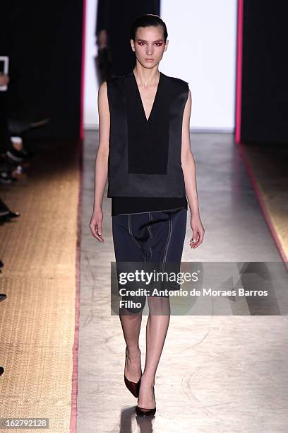 Model walks the runway during the Cedric Charlier Fall/Winter 2013 Ready-to-Wear show as part of Paris Fashion Week on February 26, 2013 in Paris,...