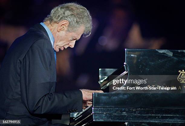 Van Cliburn plays the Star Spangled Banner at the start of a concert series promoting the Super Bowl in Arlington, Texas, September 10, 2010....