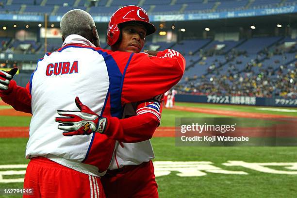 Outfielder Frederich Cepeda of Cuba celebrates an RBI single in the top half of the fifth inning during the friendly game between Hanshin Tigers and...