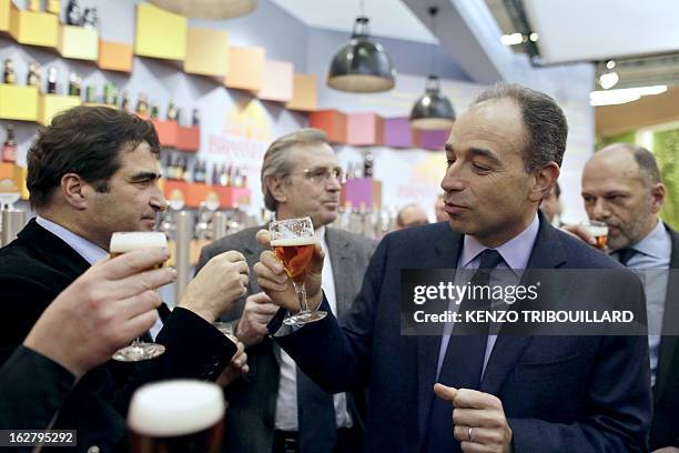 France's UMP right-wing opposition party leader Jean-Francois Cope drinks a beer with UMP group at the National Assembly, Christian Jacob, as they...