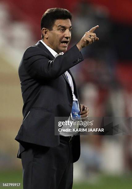Amir Ghalenoei, coach of Iran's Esteghlal gestures during the AFC Champions League football match versus Qatar's al-Rayyan clubs in the Qatari...