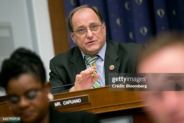 Representative Michael Capuano, a Democrat from Massachusetts, center, questions Ben S. Bernanke, chairman of the U.S. Federal Reserve, not pictured,...